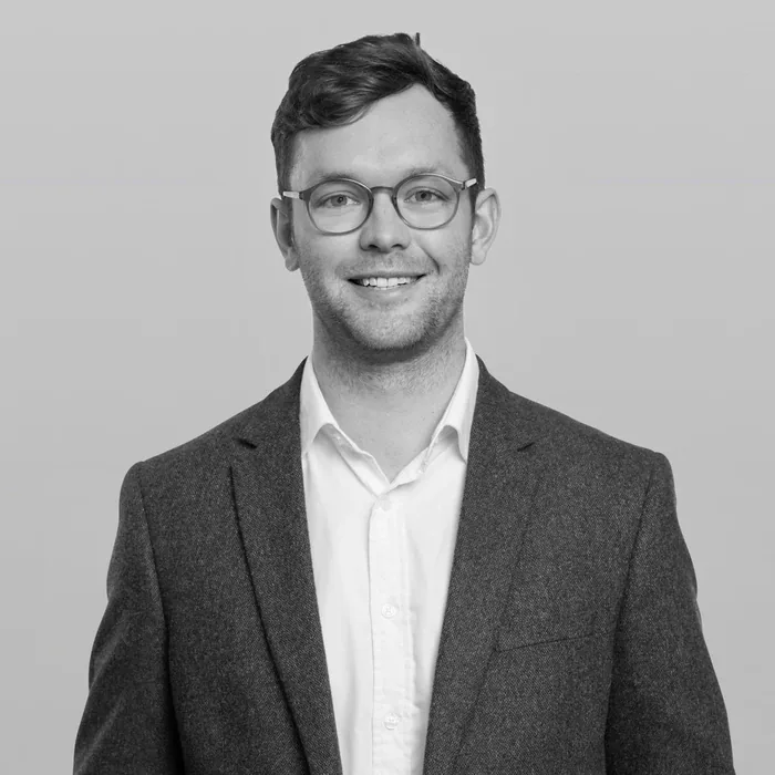 Chris, co-founder, in a black and white portrait.